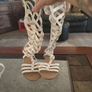 White gladiator sandals up the leg